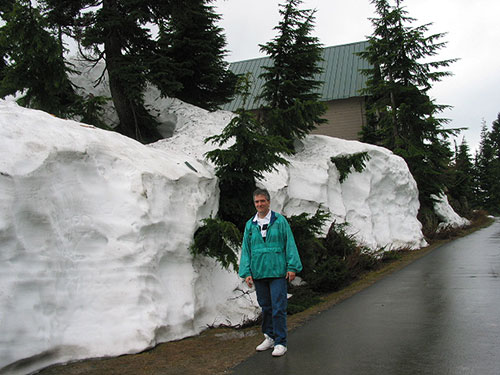 Pat in front of snow drift on Grouse Mountain