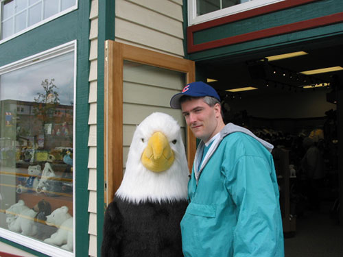 Pat stands next to stuffed eagle