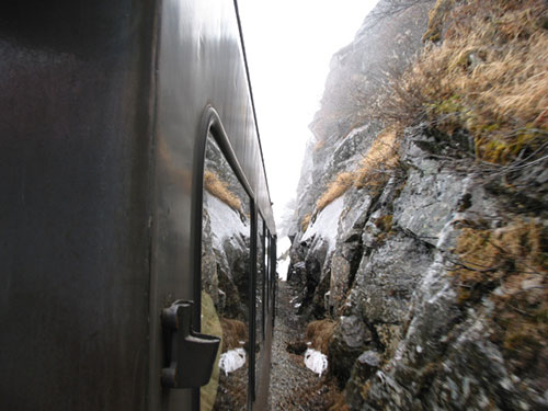 Train next to rock