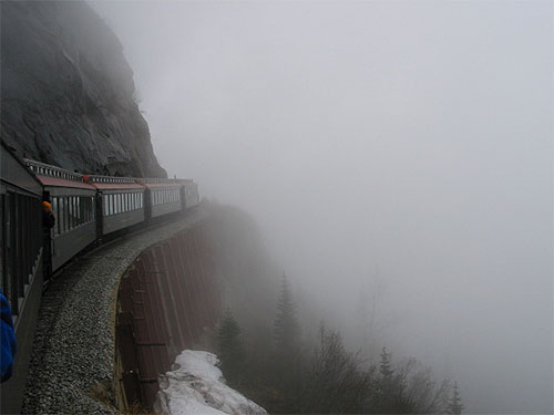 Train moves through fog