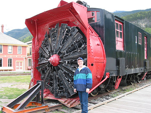 Pat in front of train with snow removal equipment in front