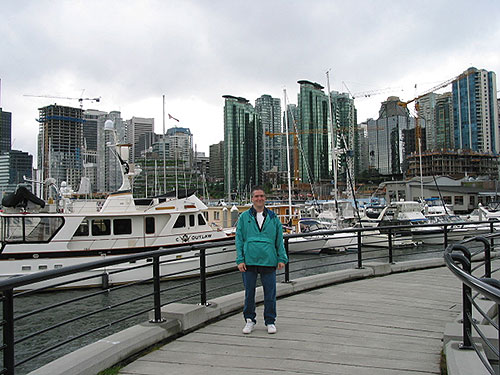 Pat at waterfront in front of boats