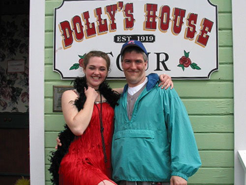 Pat in front of Ms. Dolly's with a young lady of the establishment