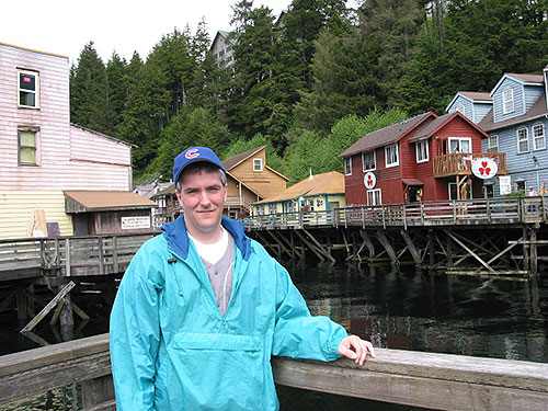 Pat in front of Creek Street with arm on railing