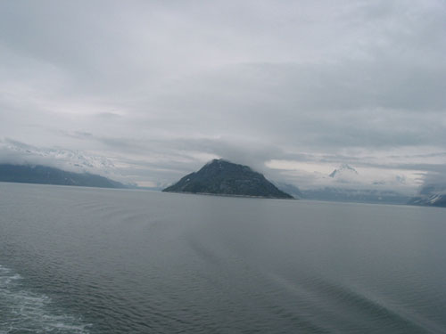 As ship leaves Glacier Bay National Park mountains and water in the background