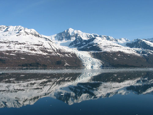 Glacier and mountain reflect in the water