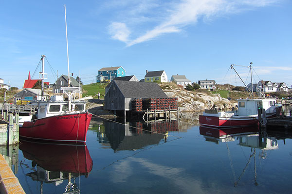 Red boat next to water