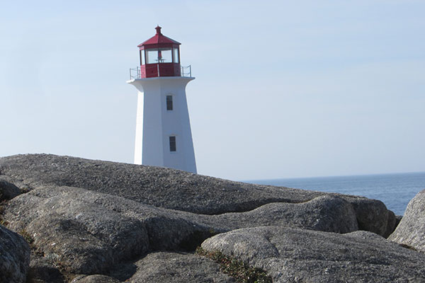Lighthouse beyond rocks