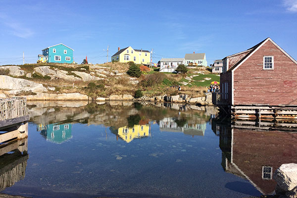 Houses on hill beyond water