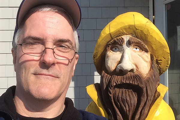 Pat with statue of old fisherman
