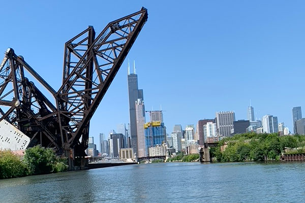 Open bridge with Sears Tower in the distance on Chicago River