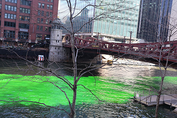 Bridge with green dye in water beneath