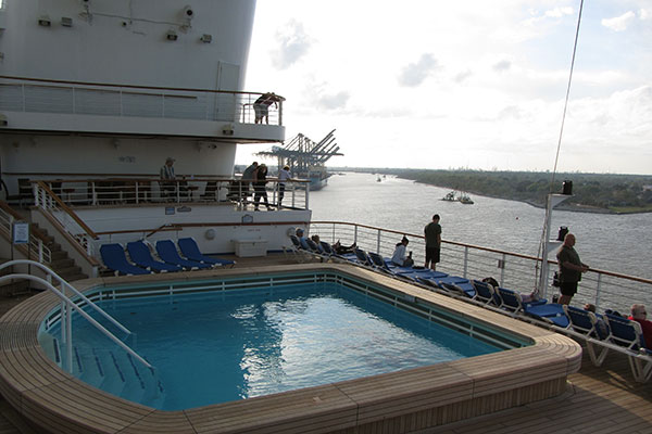 Pool on back of ship with view of Houston Bayport Cruise Terminal