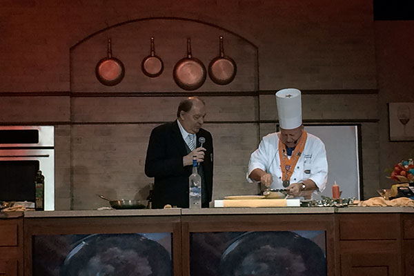 Two men doing a cooking demonstration