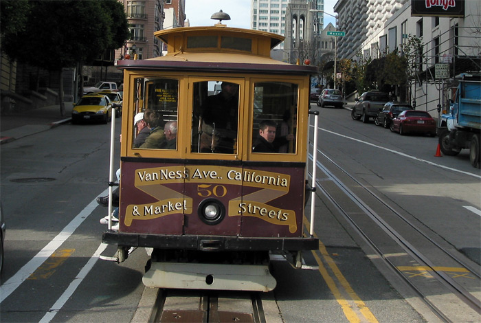 Cable Car driving on street in San Francisco