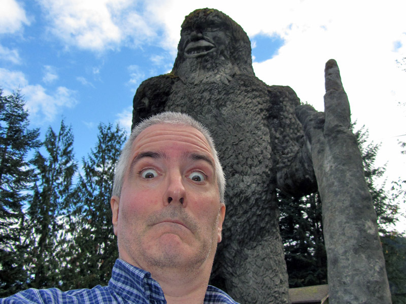 Pat by statue of Big Foot near Mount St. Helens
