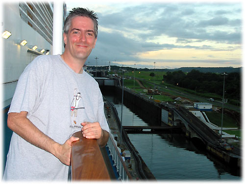 Pat standing on deck looking at locks