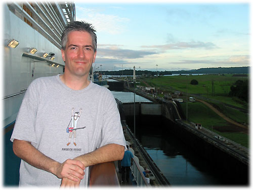 Pat leans on railing in front of two closed locks