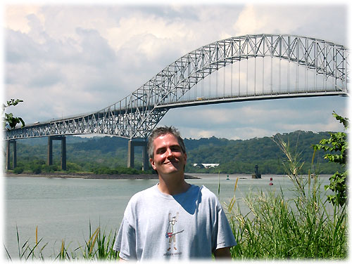 Pat stands in front of the Bridge of the Americas