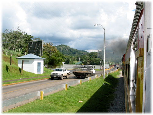 Train passes car and truck