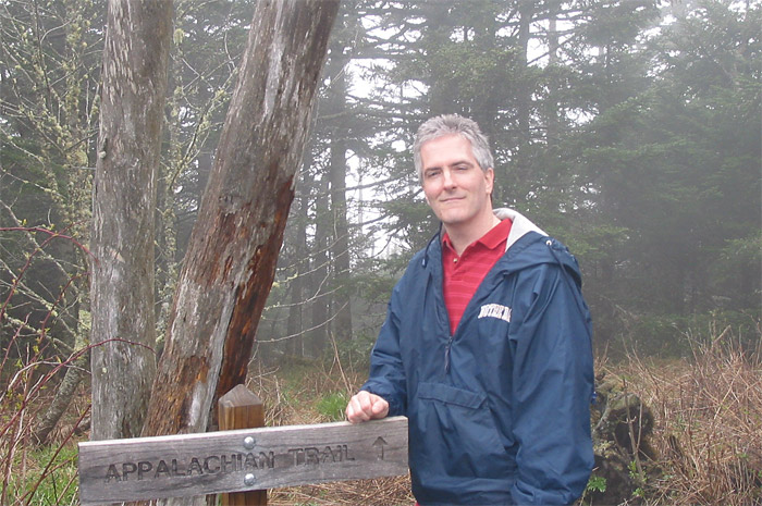 Pat standing next to Appalachian Trail Sign