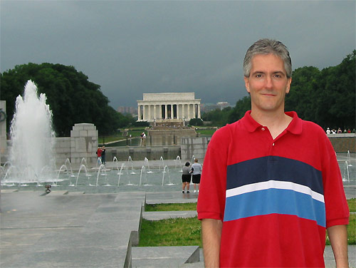 Pat at World War 2 Memorial with Lincoln Monnument in back