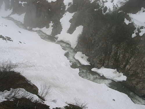 Water in valley below the train