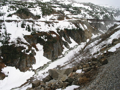 snow in valley below train