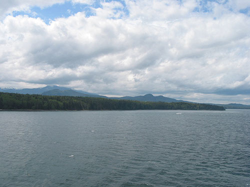 Shore with mountains in the background