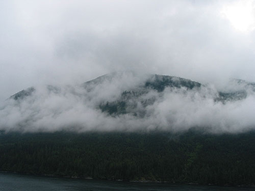 Clouds creeping over hills