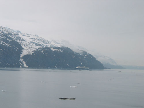 Cruise ship in front of a mountain