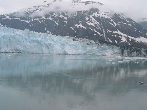 Moutnain and glacier reflect in water