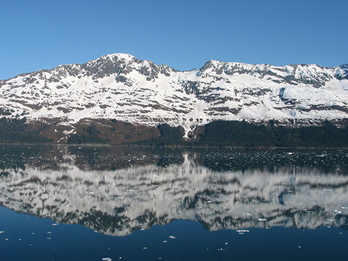 Mountains with snow on them beyond the water