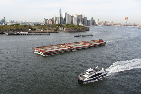 While in port small boats sail by ship