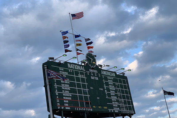 View of scoreboard from bleachers at Wrigley Field