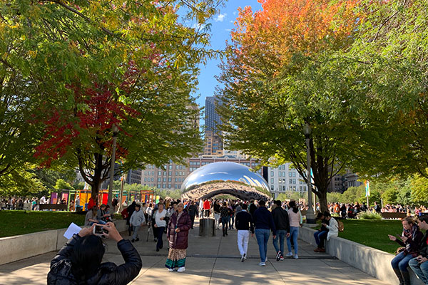 People gather at Cloud Gate in millennium Park