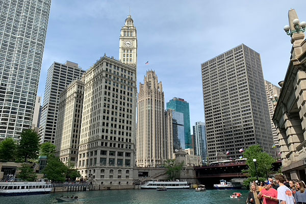 View of people walking along the Riverwalk at the Michigan Avenue Bridge