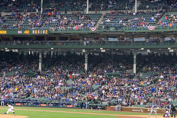 Pitcher throws pitch to batter at Wrigley Field