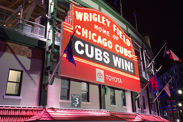 Wrigley Field marquee reads Cubs Win!