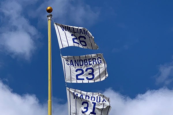 Flags with retired numbers fly over Wrigley Field