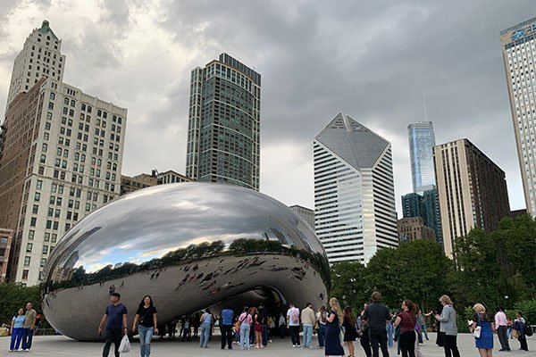 People around Millennium Park statue Cloud Gate