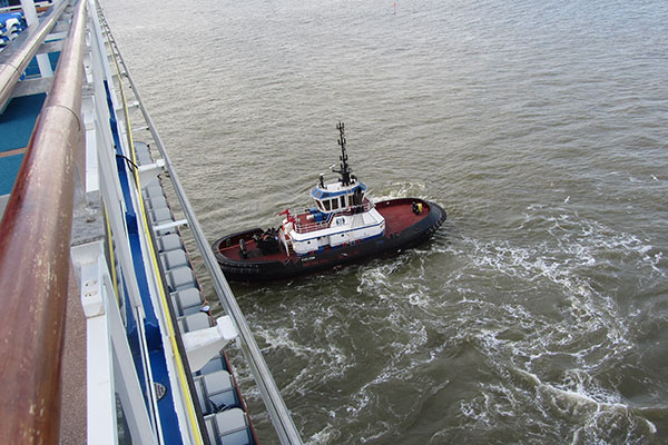 Tugboat pushes ship