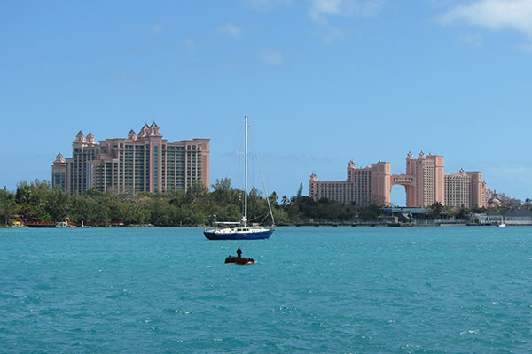 Boat in bay with resort in background