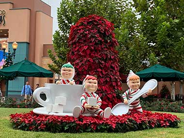 Statue display with poinsettias