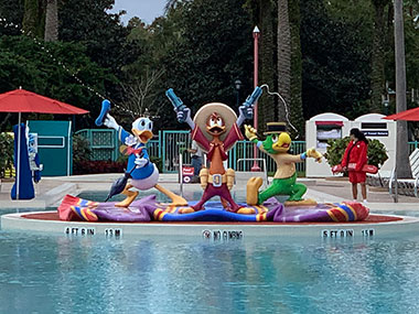 Statues of Disney Characters by pool