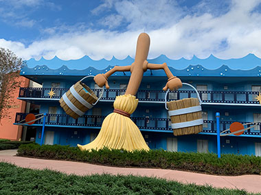 Broom holding bucket statue