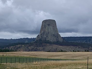 Devils Tower National Monument beyond fence