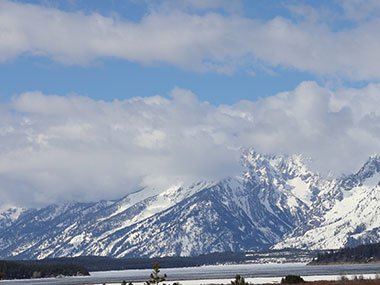 Grand Teton National Park mountains with clouds obscuring top