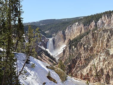 Snow in front of waterfall - Yellowstone National Park