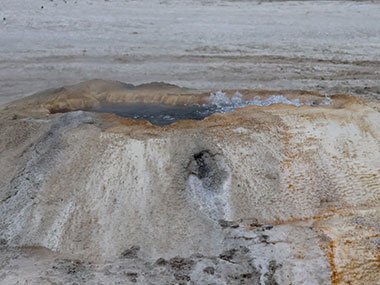Yellowstone National Park geyser bubbles over